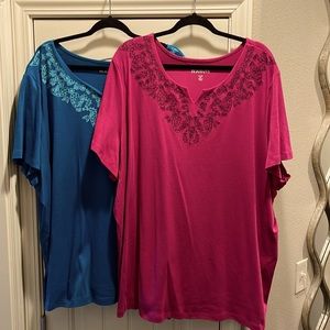 2 Roaman’s 34/36 4X women’s shirts. 1 pink 1 bluish. Washed never worn